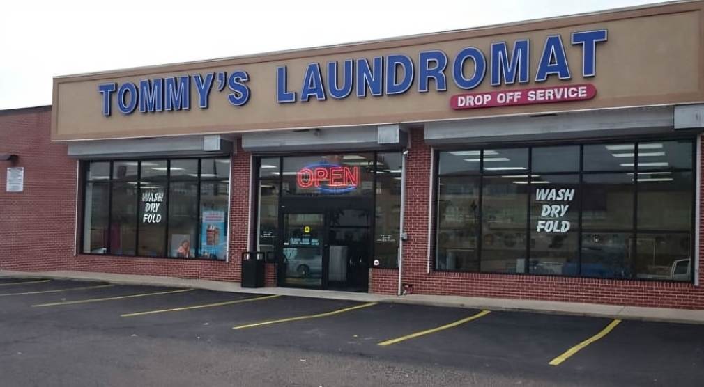 Front exterior of Tommy’s Laundromat in Philadelphia showing wash, dry, and fold drop-off service signage (1) Front exterior of Tommy’s Laundromat in Philadelphia showing wash, dry, and fold drop-off service signage